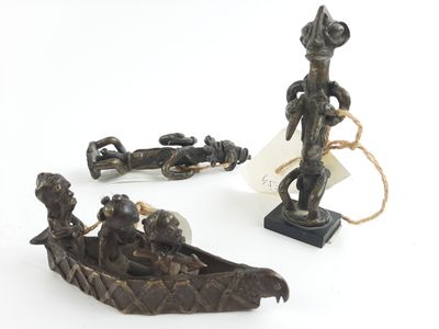 a statue of a man in a boat and other figurines