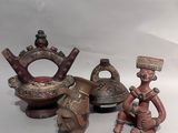 three figurines that are sitting next to each other