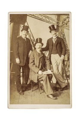 three men in top hats and tails are posing for a picture