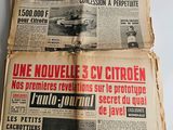 two pages of old french newspapers on a white surface