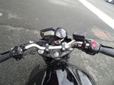 a close up of a motorcycle handlebars on a street