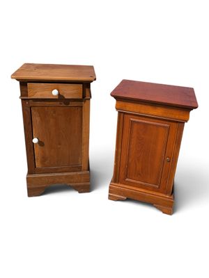 pair of wooden nightstands with drawer and door on each side