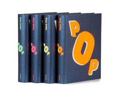 three books are stacked on top of each other on a white surface