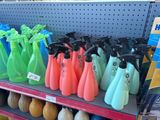 many different colored spray bottles on a shelf in a store