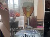 a picture of a glass of beer sitting on a table