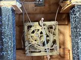 a wooden box with a clock inside of it