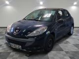 a picture of a small blue car parked on a checkered floor