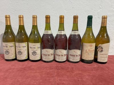 six bottles of wine are lined up on a table
