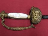 an image of a sword with a lion head on it