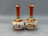 pair of chinese vases on a grey background