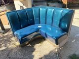 a blue couch that is sitting on the ground