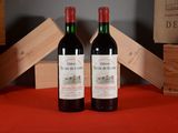 two bottles of wine sitting next to each other on a table