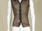 a mannequin dressed in a brown vest and tie