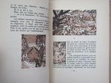 an open book with a picture of a house in it