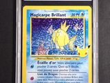 a close up of a pokemon card on a black surface