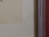 a picture of a painting of a red heart on the wall