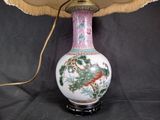 a lamp that is sitting on a table with a lamp shade on it