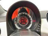 a close up of a car dashboard with a clock on it