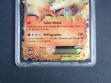 a close up of a pokemon card in a plastic container