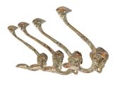 four metal hooks on a white background