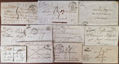 many old envelopes on the table with writing on them