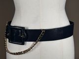 black leather belt with gold chain and buckle on mannequin torso