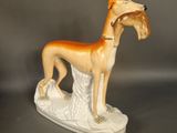 a figurine of a dog that is standing on a table
