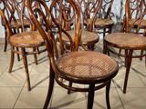 six chairs that are lined up in a row