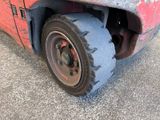 a close up of a tire on a red truck