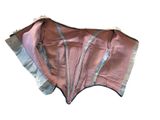 a pink corset with silver trims on it