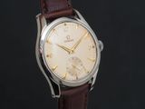 a close up of a watch with a brown leather strap