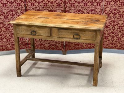 a small wooden table with two drawers on it
