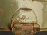 a close up of a metal object with rust on it