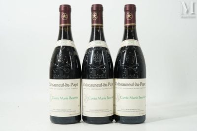 three bottles of wine sitting on top of a white table