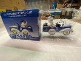 a small toy car and a box on a table