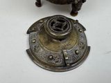 a small metal object that is sitting on a table