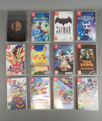 a lot of nintendo wii games on the table