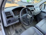 dashboard of a car with a steering wheel and dashboard controls