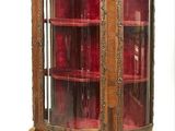 a wooden cabinet with glass doors and a red glass door