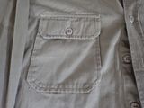 a close up of a shirt with buttons on it