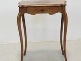 an image of a small wooden table with a glass top