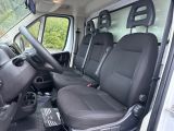 the interior of a van with black leather seats and a steering wheel