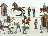 many figurines of soldiers on display on a shelf