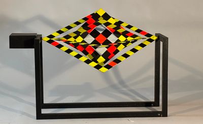 an image of a sculpture of a square with a red, yellow, and black design