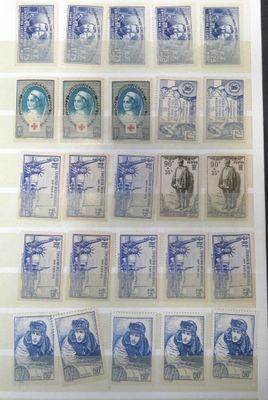 an old picture of a collection of stamps on display in a glass case