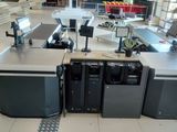 many machines that are sitting in the middle of a room