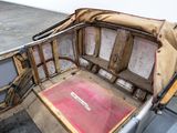 a small boat that has a seat in the back of it