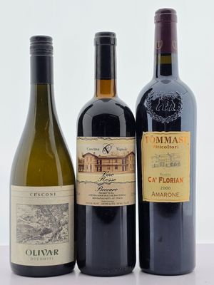 trois bouteilles de vin sont alignées sur une surface blanche
