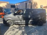 the van is parked in the parking lot outside of the building