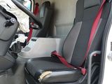 a seat in the back of a truck with a bag on it